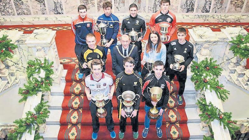 STEPS TO SUCCESS: Players from the competing teams pictured alongside Belfast Lord Mayor Arder Carson and Kukri Sports&rsquo; Leona Wells the City Hall launch of the Kukri Sports Ulster Minor Tournament which begins next Saturday