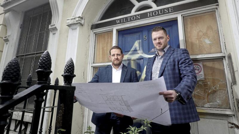 Ciaran Toman and Daniel Jackson examine their development plans outside Wilton House. 