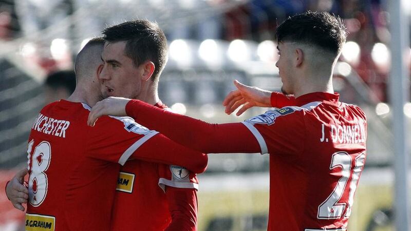 Jude Winchester congratulates Daniel Hughes after he opened the scoring in Cliftonville&rsquo;s 2-0 home win on Saturday against Ards. Picture by Pacemaker