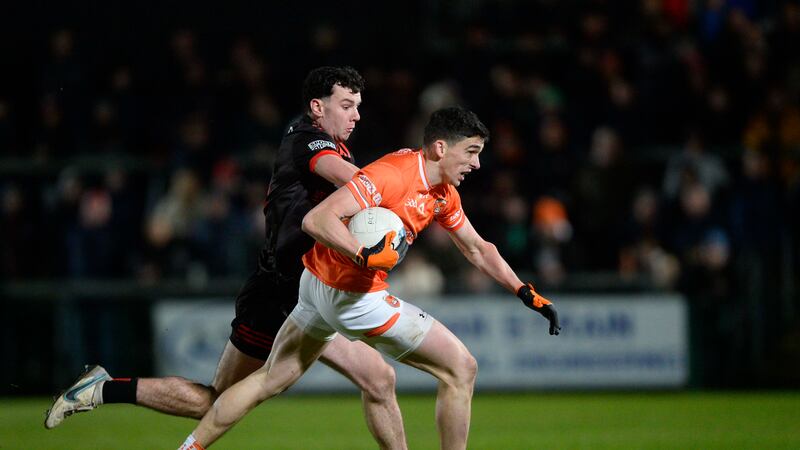 Armagh's Rory Grugan attempts to escape the attention of Louth's Craig Lennon during Saturday night's National League clash. Picture by Mark Marlow