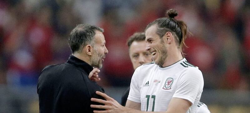 Wales star Gareth Bale (right) jokes with Ryan Giggs