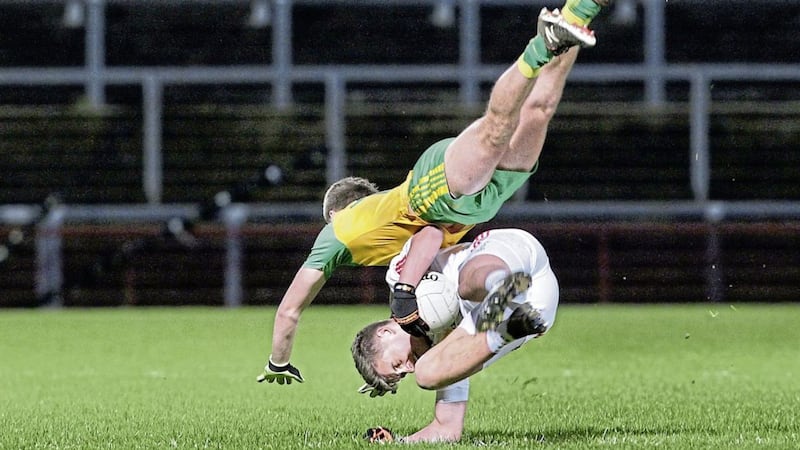 Donegal&rsquo;s Michael Carroll goes flying over Tyrone&rsquo;s Michael McKernan during the counties&rsquo; Ulster U21 FC semi-final clash last year Picture by Margaret McLaughlin 