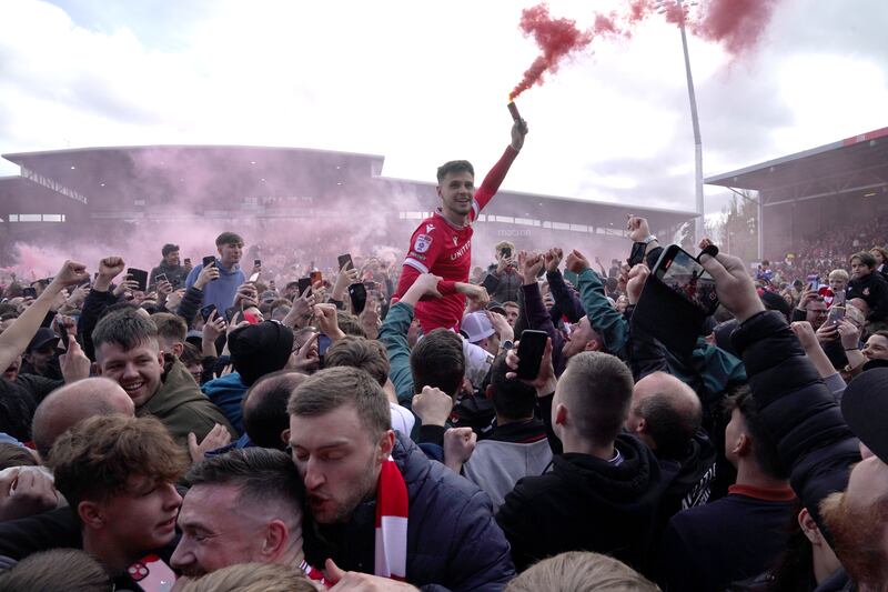 Wrexham fans celebrate their promotion .