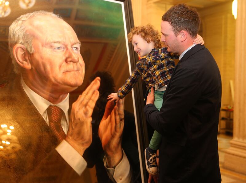 &nbsp;Martin McGuinness son Fiachra and grandson Dulta at the unveiling of the portrait of the former deputy First Minister at Parliment Buildings Picture Mal McCann.