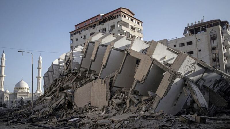 The remains of a building destroyed by Israeli airstrikes on Gaza City on Wednesday. Picture by AP Photo/Khalil Hamra 