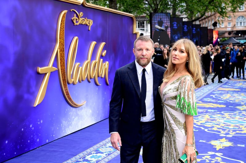Director Guy Ritchie and wife Jacqui Ritchie arrive at the Aladdin premiere in London (Ian West/PA)