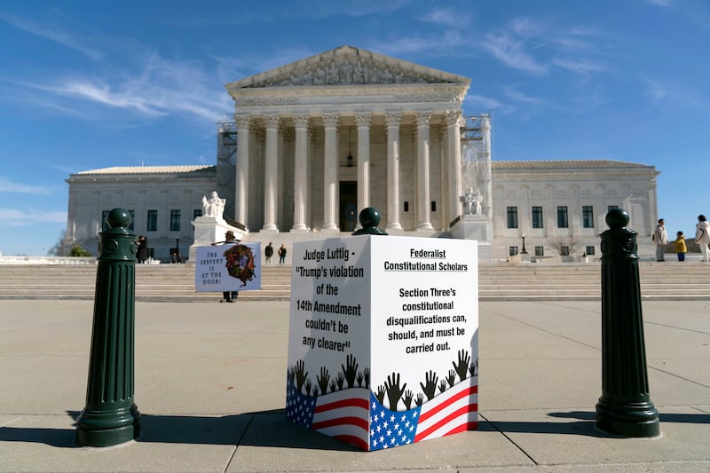 People protest outside the US Supreme Court in Washington (Jose Luis Magana/AP)