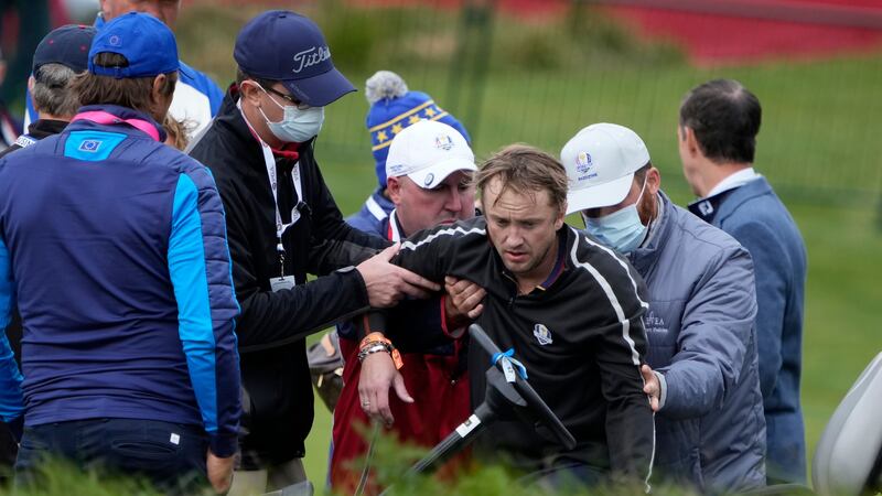 The Harry Potter star was pictured being carried off the Wisconsin course, which is hosting the Ryder Cup, on a golf cart.
