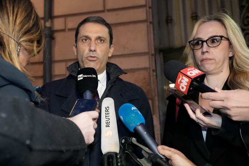 Cardinal Angelo Becciu’s lawyers Fabio Viglione, left, and Maria Concetta Marzo speak to reporters after the verdict (AP Photo/Andrew Medichini)