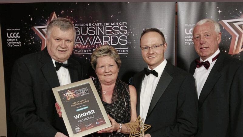 Hillmount garden centre owners Edith, Alan and Robin Mercer are congratulated by Gary McDonald, business editor of category sponsors the Irish News, after it was named best family business at Lisburn &amp; Castlereagh City Business Awards. Photo: Kelvin Boyes/PressEye 