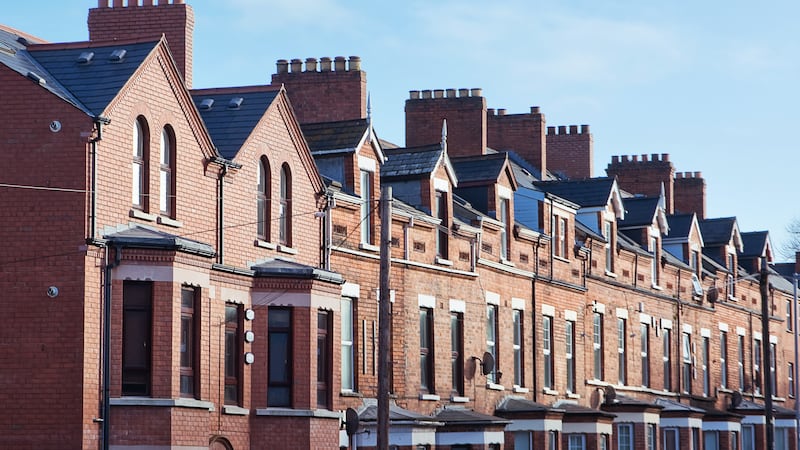 Red brick houses on a street in Belfast.