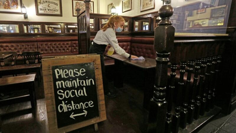 Staff get set for reopening at the Morning Star Bar in Belfast. Picture by Hugh Russell 