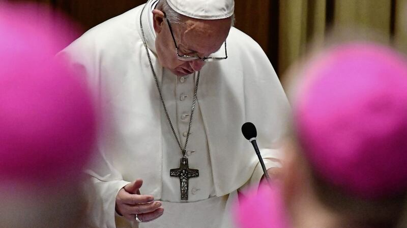 Pope Francis prays at the opening of a sex abuse prevention summit, at the Vatican Picture by Vincenzo Pinto/AP 