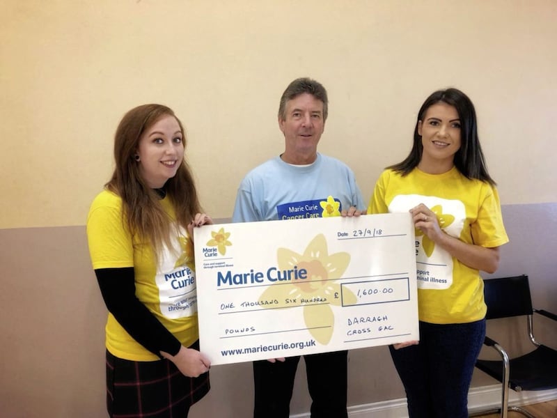 St Mochai&rsquo;s, Darragh Cross recently held a coffee morning and raised &pound;1,600 for Marie Curie. Pictured are Ivan Shannon, treasurer of Marie Curie Down fundraising group, Naomi Carson club&rsquo;s children&rsquo;s officer, and Gemma Lenaghan, club vice secretary 
