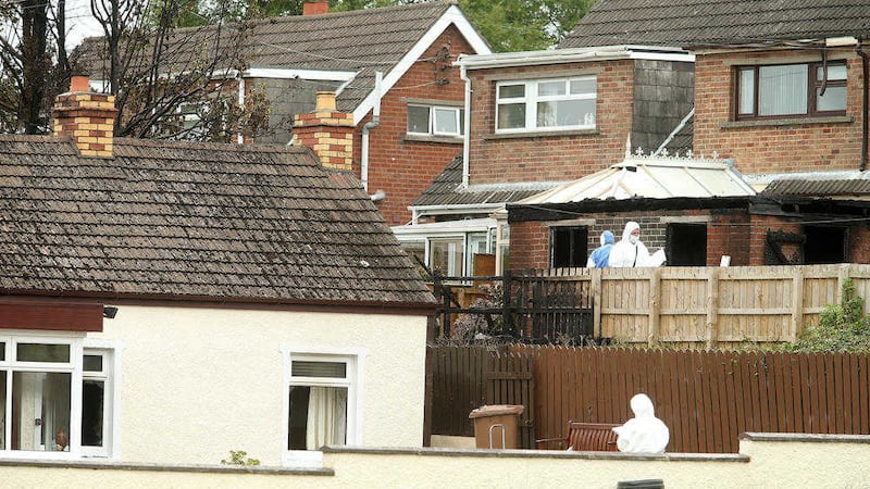 Forensic officers at the scene of the fire which killed 91-year-old Samuel Carson in 2014. Picture by Mal McCann 