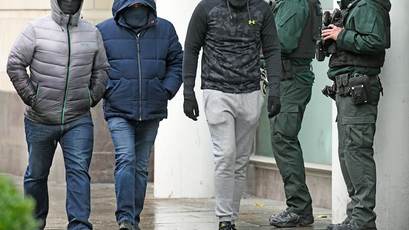 There was a tight security operation in place for the second day running as masked men attended Belfast Crown Court. Picture, Alan Lewis - Photopress.