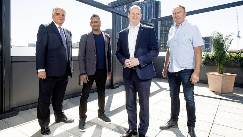 Harness co-founder Jyoti Bansal (second from left) with (L-R): interim Invest NI boss Mel Chittock; Economy Minister Gordon Lyons; and Nick Smyth, Harness site lead for Belfast. 