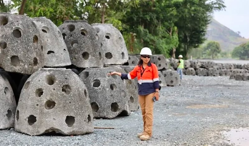 Lovelle Cariaga, 41, Filminera environmental manager, shows some of the 400 reef balls ready for deployment in May 2023. Reef balls act like coral reefs, presenting as a habitat for marine life. (Photo by Rhaydz B. Barcia)