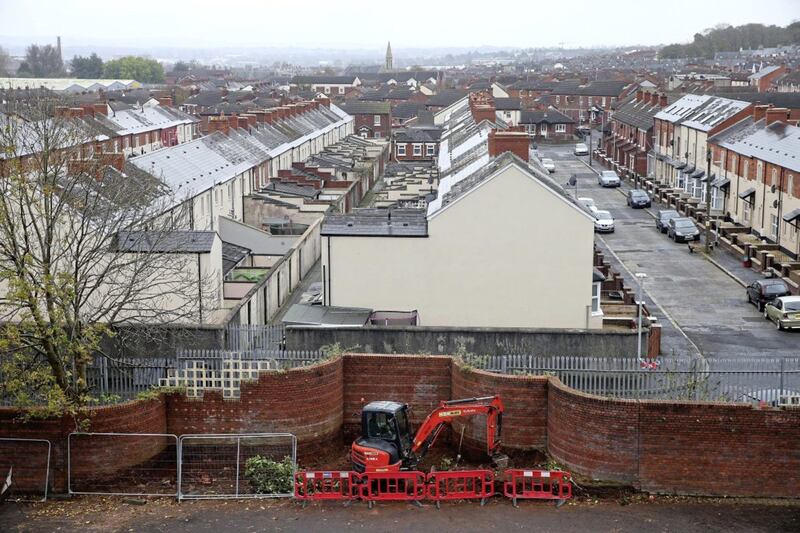 Work begins on modifying the Peacewall on the loyalist side of the Crumlin Road Picture Mal McCann. 