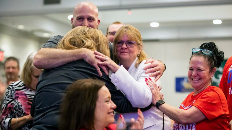 Family and supporters of Virginia’s Danny Diggs, including his wife, Patty, white jacket, celebrate during a watch party at the City Centre Holiday Inn in Newport (The Virginian-Pilot via AP)