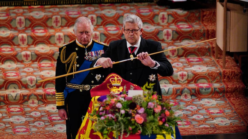 The King watches as the Lord Chamberlain breaks his Wand of Office at the committal service for Queen Elizabeth II