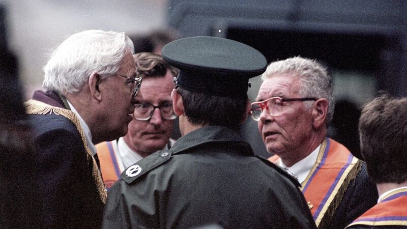 Ian Paisley, David Trimble and Harold Gracey talk to the police at the bottom of the Garvaghy road after the 1995 parade was allowed to pass down the road. Picture by Pacemaker 