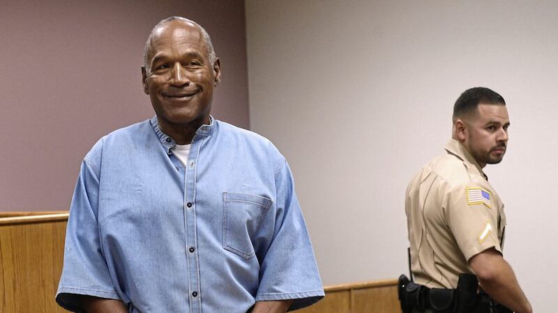 Former NFL football star OJ Simpson enters for his parole hearing at the Lovelock Correctional Center in Lovelock, Nevada. Simpson was convicted in 2008 of enlisting some men he barely knew, including two who had guns, to retrieve from two sports collectibles sellers some items that Simpson said were stolen from him a decade earlier 