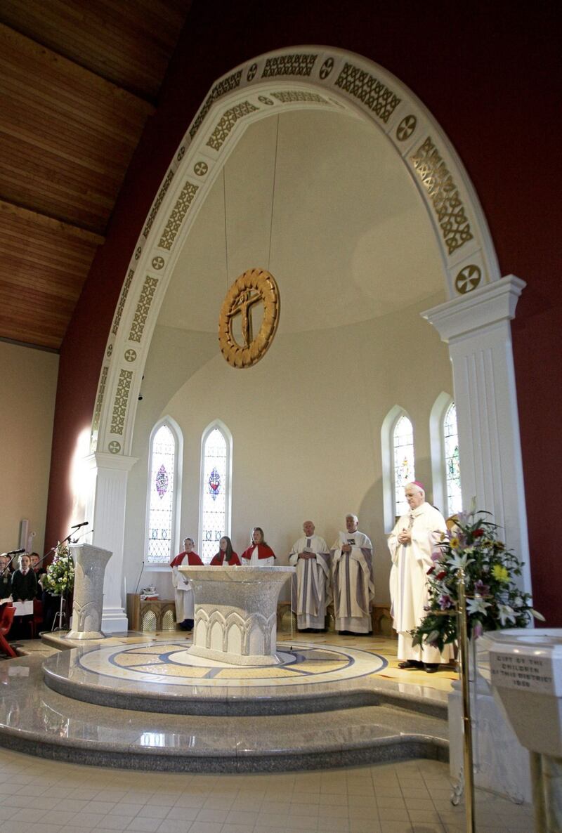 Bishop of Down and Connor Noel Trainor blesses the newly-rebuilt Holy Cross Church in Atticall. Picture by Cliff Donaldson 