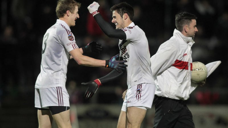 Slaughtneil's Brendan Rogers and Chrissy McKaigue celebrate at the final whistle after beating Ballinascreen in Tuesday night's Derry SFC quarter-final at Owenbeg <br />Picture: Margaret McLaughlin&nbsp;