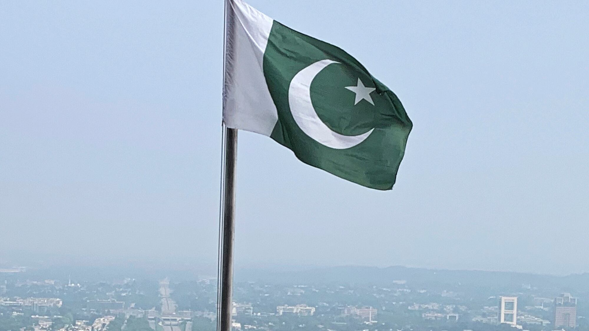 A Pakistani flag flies on a lookout in Islamabad, Pakistan, on July 27, 2022 (Rahmat Gul/AP, File)