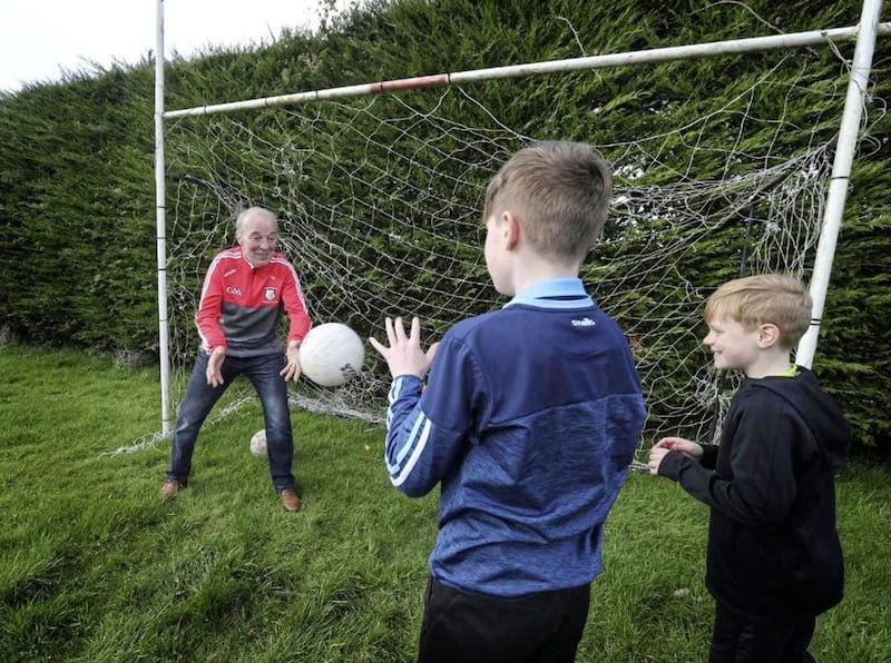 Paddy Park plays with his grandchildren 