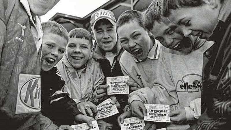 JUST THE TICKET...young Cliftonville fans who queued for tickets for the home game against Glentoran tomorrow 