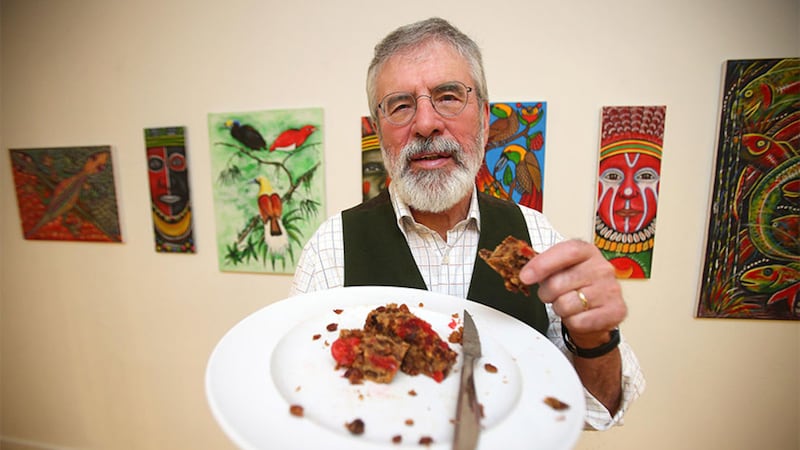 Gerry Adams launched his cookbook with some of his fruitcake-style pudding. Picture by Mal McCann
