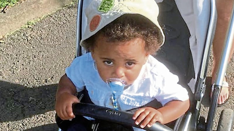 West Belfast toddler, Ryan , who was racially abused on the Falls Road 