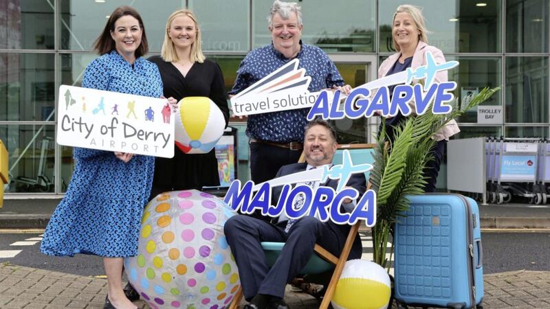 Launching the 2022 summer sun routes from Derry are Steve Frazer, managing director of City of Derry Airport (seated) and its head of business development Brenda Morgan (left) with Travel Solutions&#39; Laura Laurie (commercial manager), Peter McMinn (managing director) and Julie Magill (operations director) 