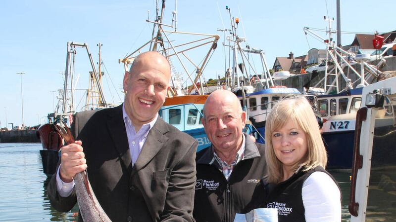 Pictured, from left, Invest NI director of food John Hood, managing director Harold Nicholson and Lisa McBride Sales and marketing manager from Mourne Seafoods 