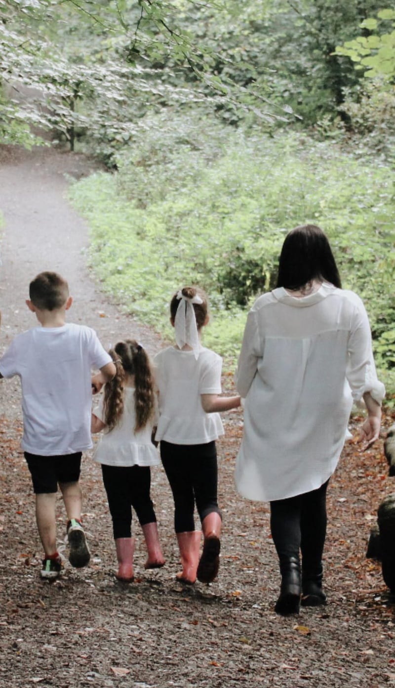 Shauna Kaleta and her three children walking away