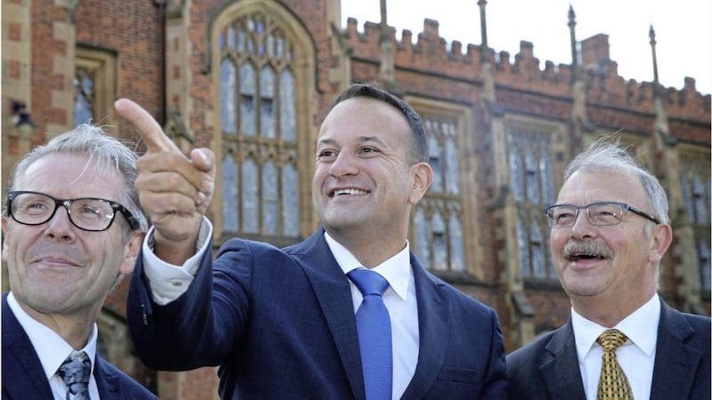 Taoiseach Leo Varadkar (centre) is welcomed to Queen&#39;s University Belfast. Picture by Hugh Russell 