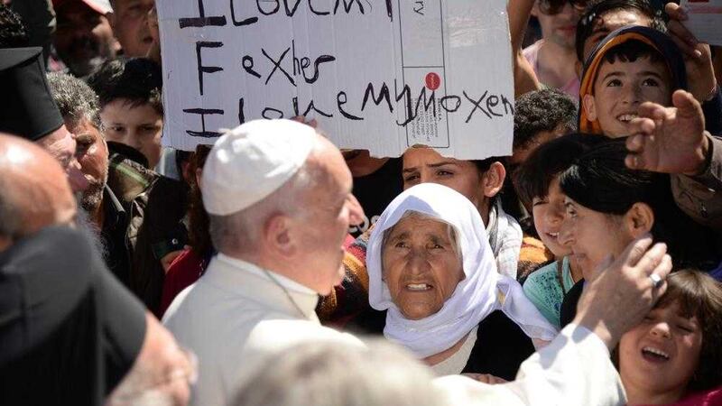 Pope Francis meets refugees at the Moria refugee camp, on the Greek island of Lesbos.  Picture by Filippo Montef, Associated Press