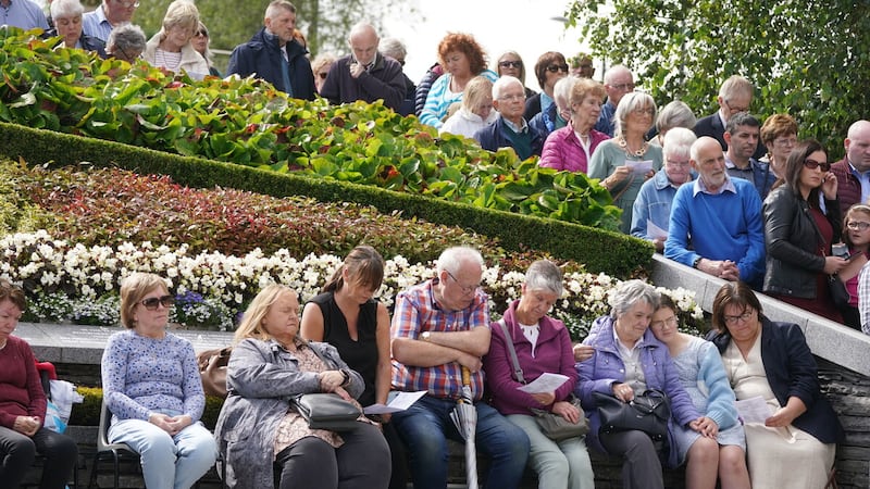 People attend a service to mark the 25th anniversary of the bombing that devastated Omagh in 1998, at the Memorial Gardens in Omagh, Co Tyrone on Sunday August 13, 2023. PA Photo. Brian Lawless/PA Wire..