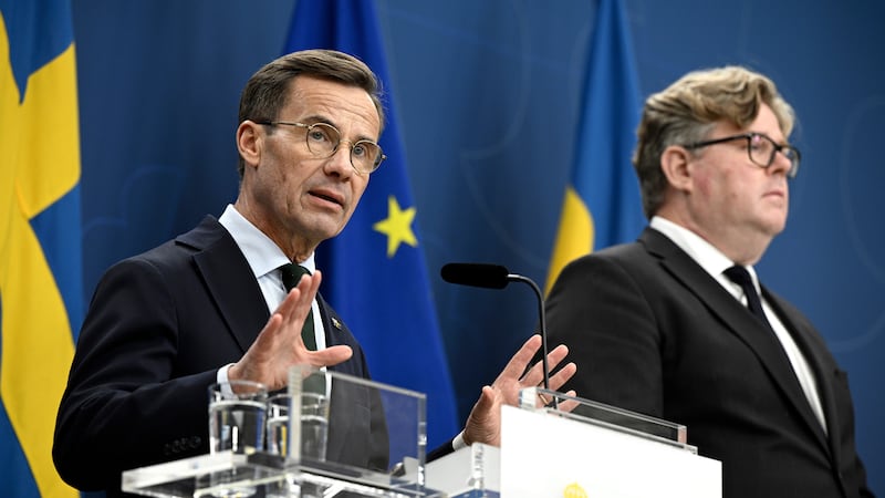Sweden’s Prime Minister Ulf Kristersson, left, and Minister of Justice Gunnar Strommer attend a press conference after a meeting with police chief Anders Thornberg (Anders Wiklund/TT News Agency via AP)