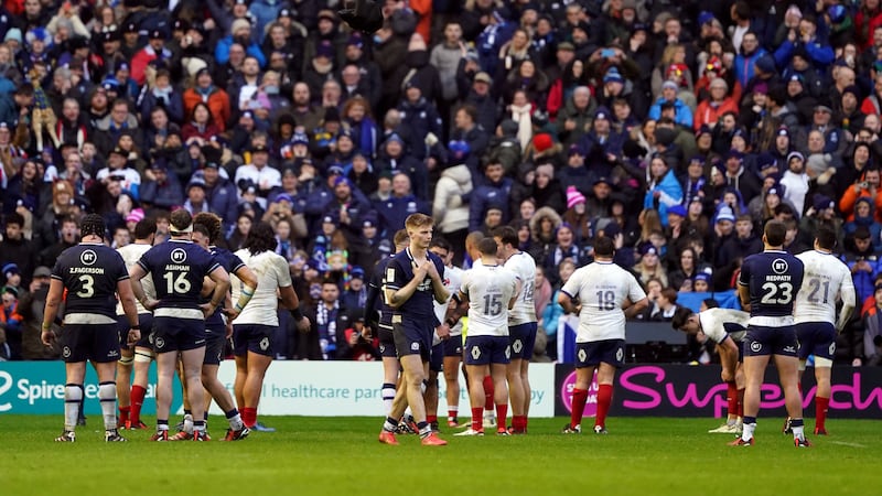 Scotland players stand dejected at the final whistle