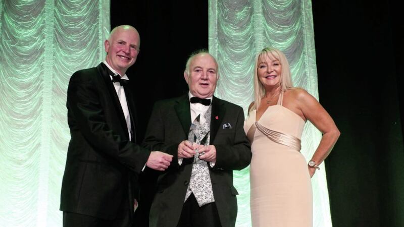 Brian Gillan, head of retail &amp; NI at AIB (left), and Business Eye&#39;s Brenda Buckley, present the Lifetime Achievement Award to Dr Terry Cross 