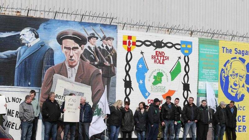 The 32 County Sovereignty Movement protest against the new Edward Carson mural on the Falls Road in west Belfast yesterday. Picture by Hugh Russell 