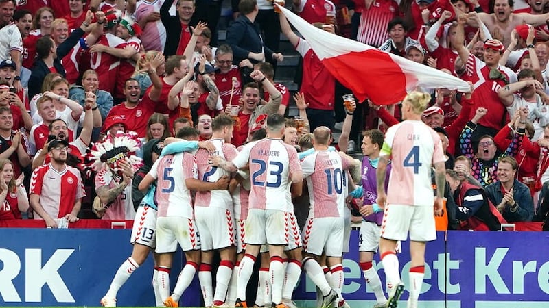 Denmark’s Jonas Wind (hidden) celebrates scoring their side’s first goal (Zac Goodwin/PA)
