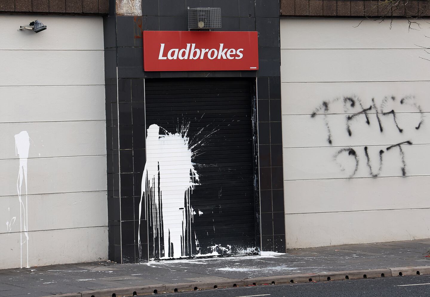 Sectarian graffiti on south Belfast bookmakers shop being treated as ...