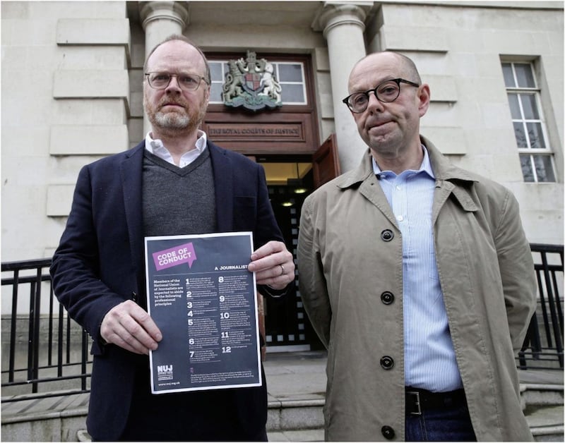Trevor Birney and Barry McCaffrey with the NUJ&#39;s code of conduct. Picture by Hugh Russell 