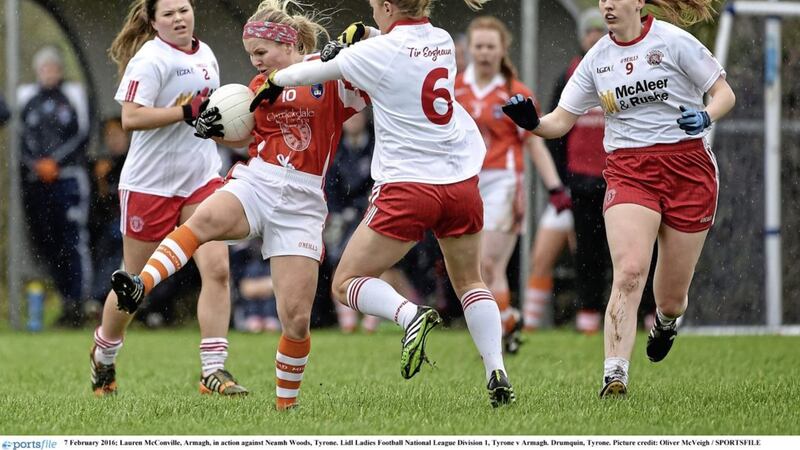 Lauren McConville of Armagh shields the ball from Tyrone&rsquo;s Neamh Woods during the league meeting between the sides in 2016 Picture by Oliver McVeigh / Sportsfile 