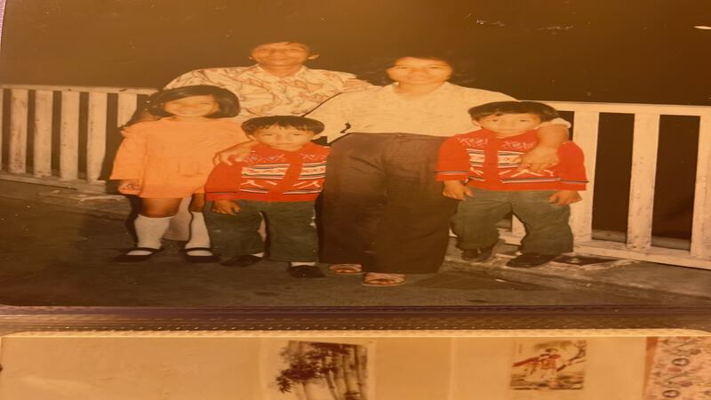 Yen Hoang Lam (left) with her mother, father and younger twin brothers in Hong Kong (Yen Hoang Lam)