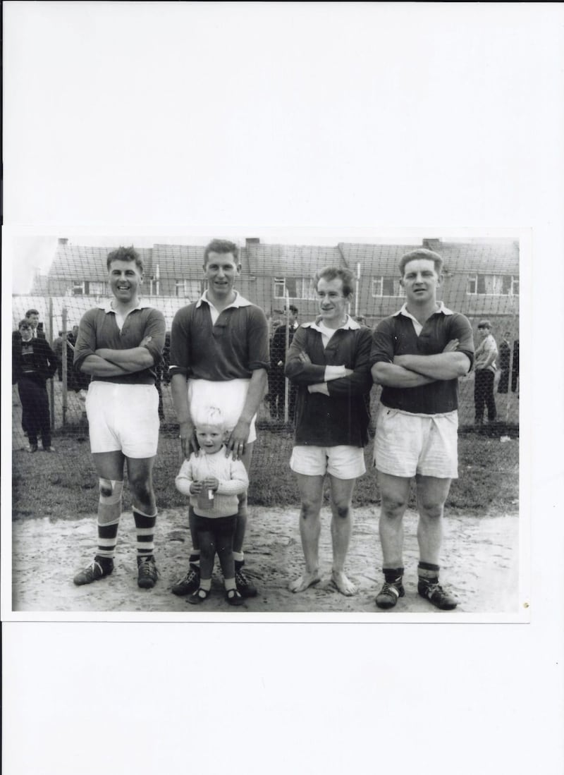 James O'Keefe, pictured with his hands on his son Se&aacute;n's shoulders, at the drawn 1966 Fermanagh senior football final between Newtownbutler and Devenish. His brother Gabriel is to his right